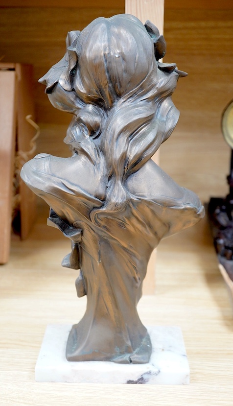 An Art Nouveau style bronzed bust of a lady on marble base, 34cm. Condition - fair